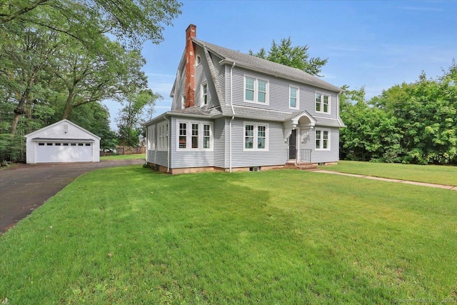 502 Adams St, Manchester, CT 06040 - view of front of property with a chimney, a garage, an outdoor structure, and a front lawn