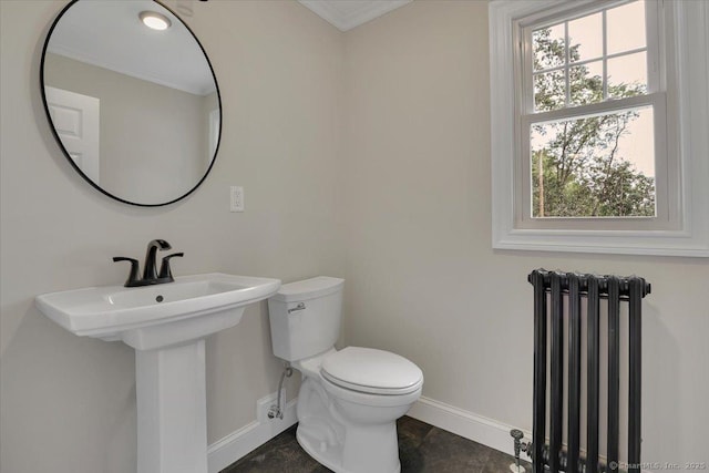 502 Adams St, Manchester, CT 06040 - half bath featuring radiator heating unit and crown molding