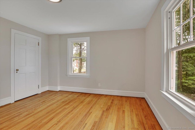 502 Adams St, Manchester, CT 06040 - empty room featuring healthy amount of natural light and light wood-type flooring