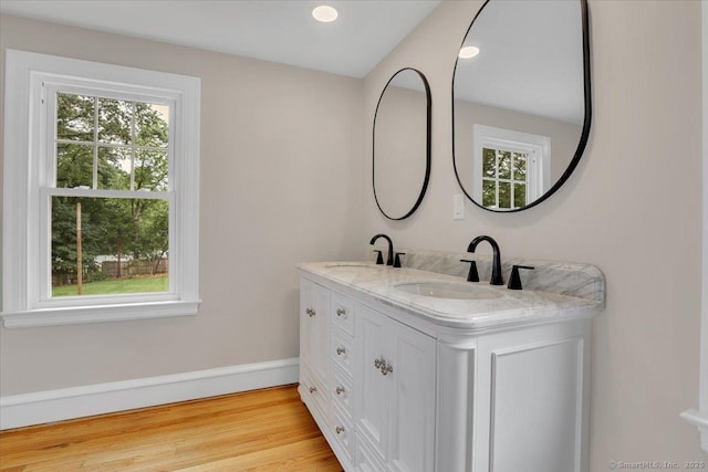 502 Adams St, Manchester, CT 06040 - full bathroom featuring double vanity, wood finished floors, and recessed lighting