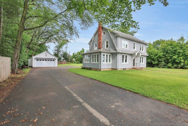 502 Adams St, Manchester, CT 06040 - view of home's exterior featuring a detached garage and an outdoor structure