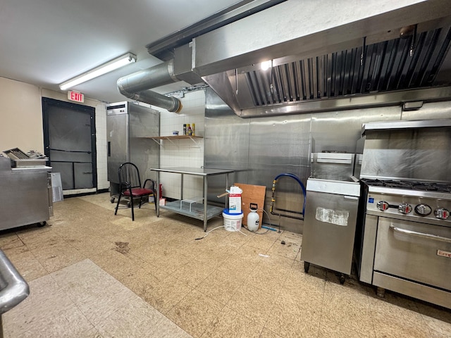 1485 Corbin Ave, New Britain, CT 06053 - kitchen featuring tile patterned floors, extractor fan, and high end stainless steel range