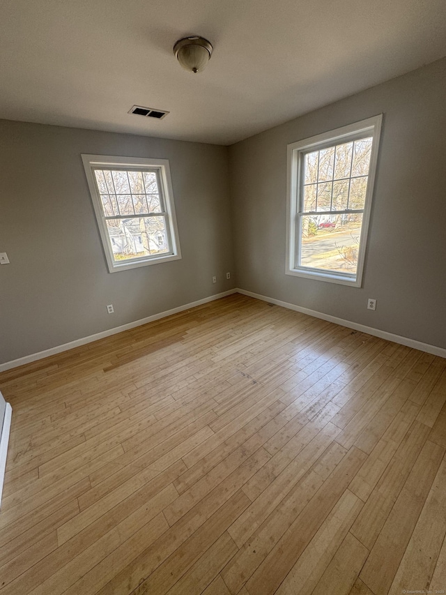 28 Devon Dr, Manchester, CT 06040 - empty room with light wood finished floors and baseboards