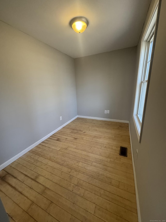 28 Devon Dr, Manchester, CT 06040 - empty room with light wood-style floors and baseboards