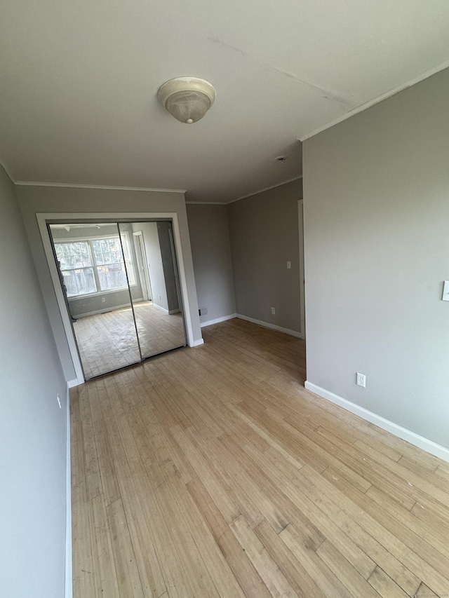 28 Devon Dr, Manchester, CT 06040 - empty room featuring crown molding and light wood-type flooring