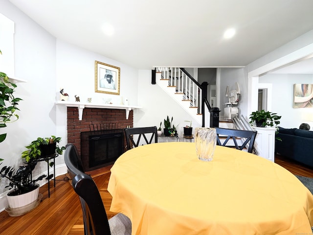 18 Victory St, Bridgeport, CT 06606 - dining area with wood finished floors, stairs, a fireplace, and recessed lighting
