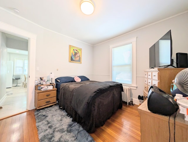 18 Victory St, Bridgeport, CT 06606 - bedroom with radiator, light wood-style floors, ornamental molding, and multiple windows