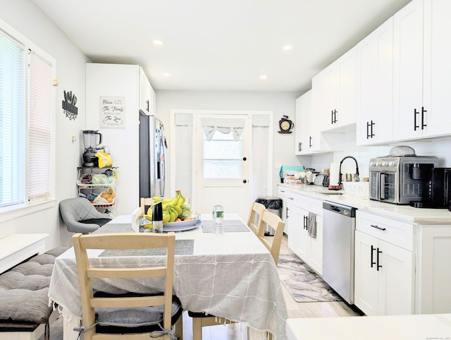 18 Victory St, Bridgeport, CT 06606 - kitchen with appliances with stainless steel finishes, plenty of natural light, recessed lighting, white cabinets, and light countertops