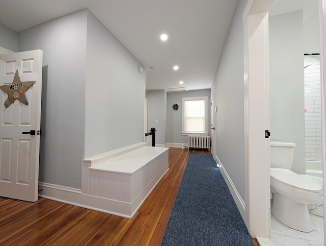 18 Victory St, Bridgeport, CT 06606 - hall with radiator heating unit, wood finished floors, and recessed lighting