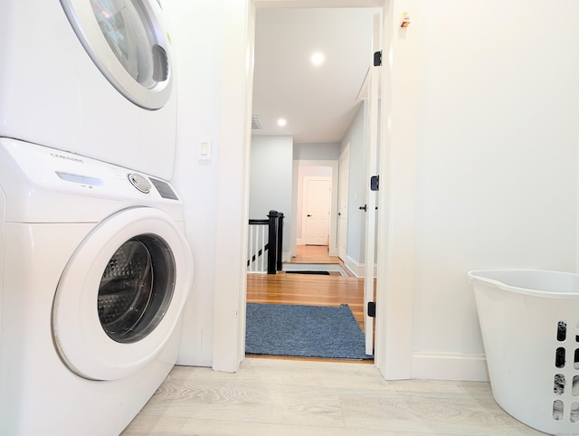 18 Victory St, Bridgeport, CT 06606 - laundry area featuring stacked washer / dryer, wood finished floors, and recessed lighting