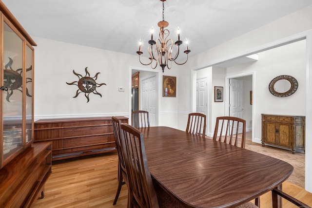 16 Spinnaker Dr Unit 16, East Lyme, CT 06357 - dining room with a chandelier and light wood-style floors