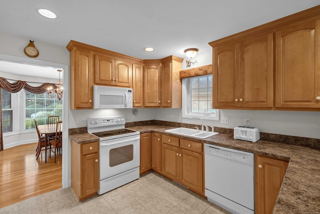 16 Spinnaker Dr Unit 16, East Lyme, CT 06357 - kitchen featuring white appliances, a chandelier, dark countertops, recessed lighting, and brown cabinets