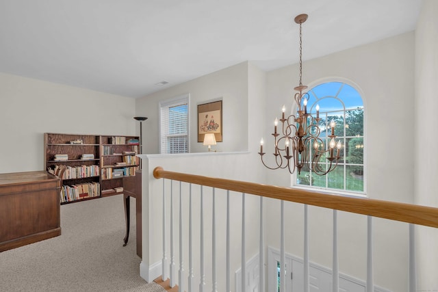16 Spinnaker Dr Unit 16, East Lyme, CT 06357 - hall featuring a chandelier, healthy amount of natural light, carpet, and an upstairs landing