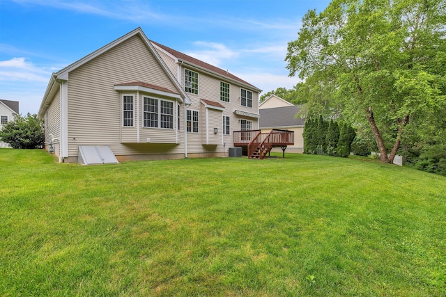 16 Spinnaker Dr Unit 16, East Lyme, CT 06357 - rear view of house featuring a wooden deck and a yard