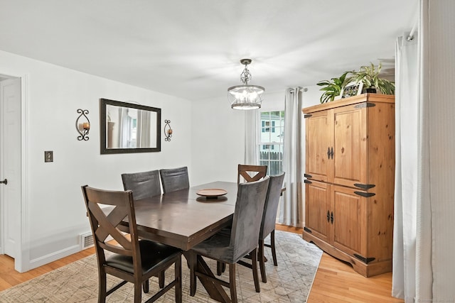 17 Wilstar Cir, Enfield, CT 06082 - dining room featuring light wood-style floors and a chandelier