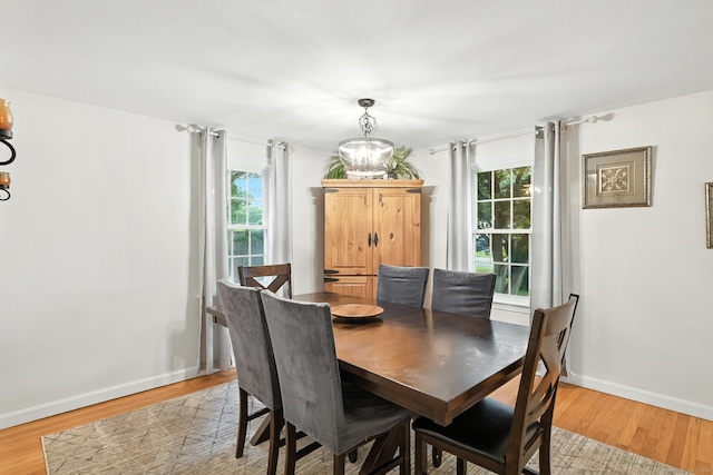 17 Wilstar Cir, Enfield, CT 06082 - dining area with light wood-type flooring, plenty of natural light, and a chandelier