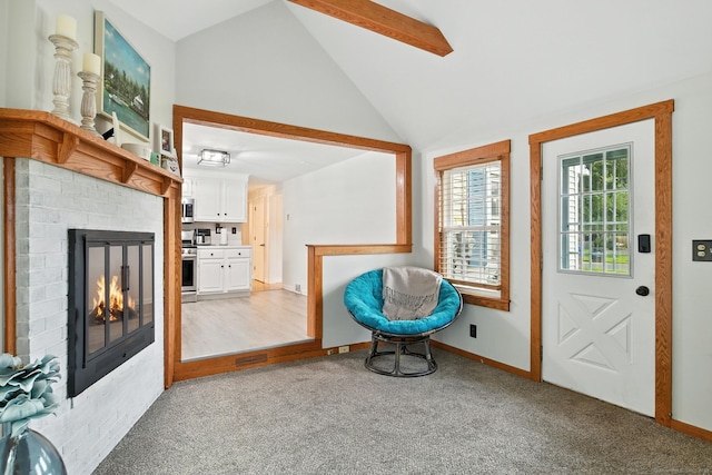 17 Wilstar Cir, Enfield, CT 06082 - entryway featuring light carpet, vaulted ceiling, and a brick fireplace