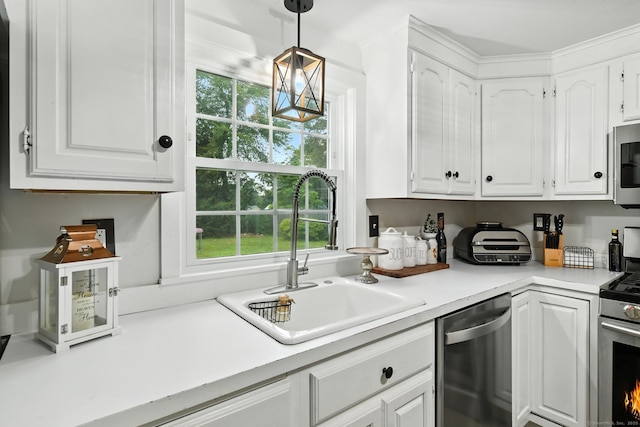 17 Wilstar Cir, Enfield, CT 06082 - kitchen featuring appliances with stainless steel finishes, white cabinets, light countertops, and pendant lighting