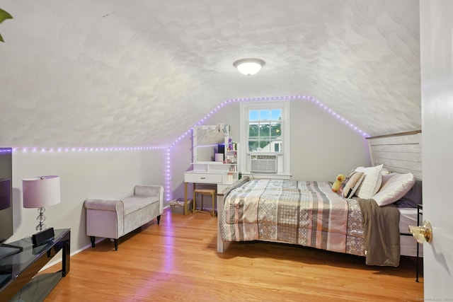17 Wilstar Cir, Enfield, CT 06082 - bedroom featuring vaulted ceiling, wood finished floors, and a textured ceiling