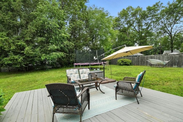 17 Wilstar Cir, Enfield, CT 06082 - wooden deck featuring a trampoline, outdoor lounge area, and view of scattered trees