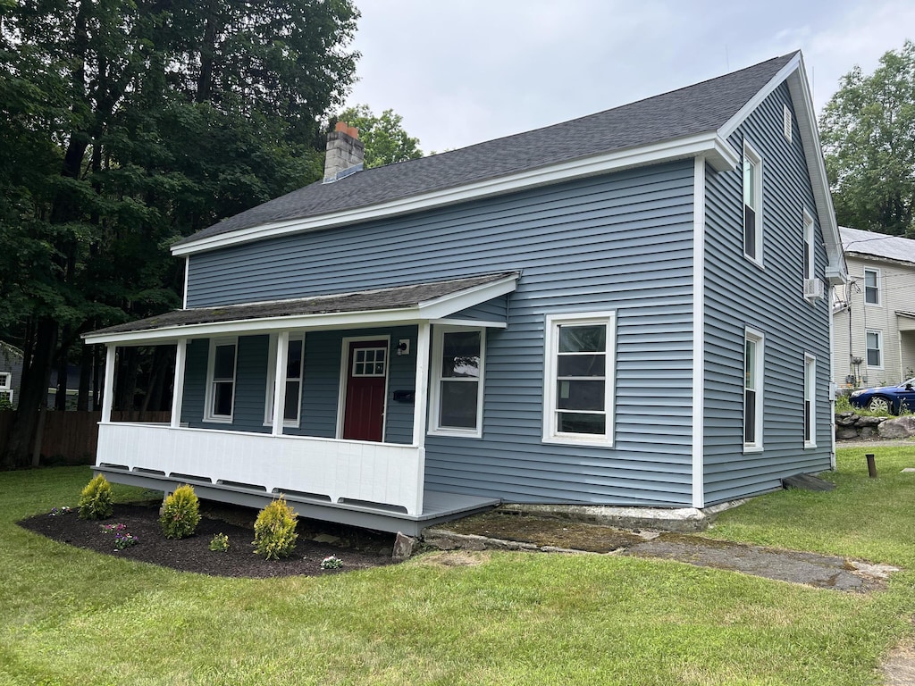 15 John St, Winchester, CT 06098 - view of front facade featuring covered porch, a front yard, a chimney, and roof with shingles