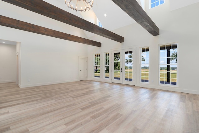 30 Tyrone Rd, Pomfret, CT 06259 - unfurnished living room with high vaulted ceiling, beamed ceiling, a chandelier, healthy amount of natural light, and wood finished floors