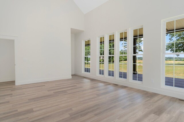 30 Tyrone Rd, Pomfret, CT 06259 - spare room with light wood-style flooring and high vaulted ceiling