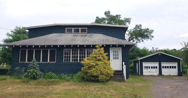 127 S Main St, East Windsor, CT 06088 - view of front of house with an outbuilding, roof with shingles, and a garage