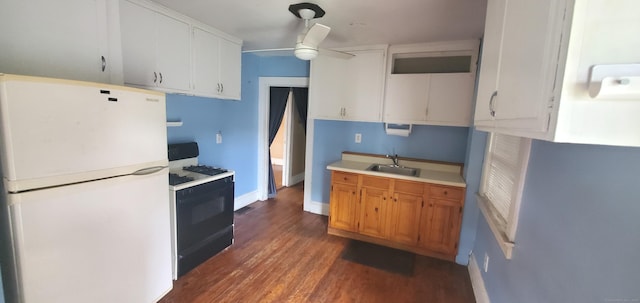 127 S Main St, East Windsor, CT 06088 - kitchen with freestanding refrigerator, gas range, ceiling fan, dark wood-style floors, and light countertops