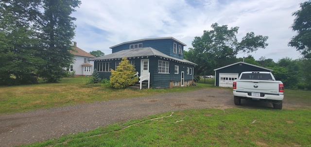 127 S Main St, East Windsor, CT 06088 - view of front of property featuring an outdoor structure, a detached garage, entry steps, driveway, and a front yard