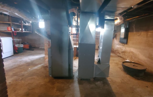 127 S Main St, East Windsor, CT 06088 - unfinished basement featuring washer and dryer