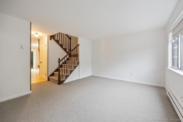 241 Judith Ln Unit 2, Waterbury, CT 06704 - carpeted empty room featuring baseboard heating and stairway