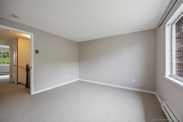 241 Judith Ln Unit 2, Waterbury, CT 06704 - carpeted empty room with a baseboard heating unit and a smoke detector
