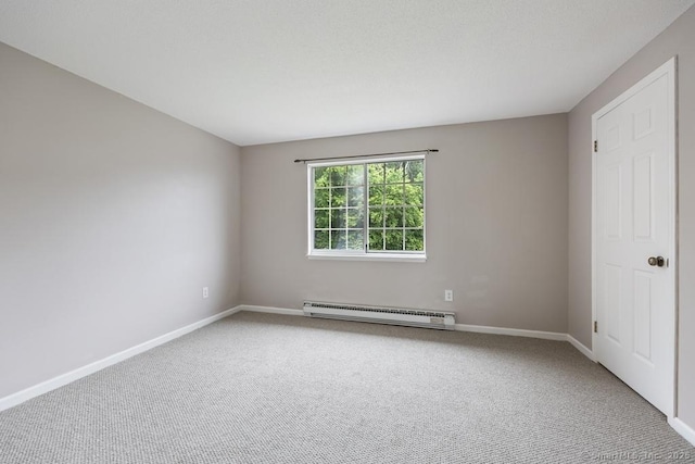 241 Judith Ln Unit 2, Waterbury, CT 06704 - carpeted empty room featuring a baseboard heating unit and baseboards