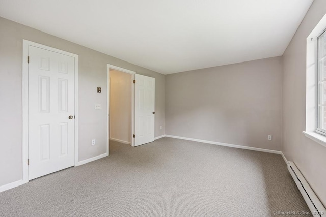 241 Judith Ln Unit 2, Waterbury, CT 06704 - unfurnished bedroom featuring a baseboard radiator and carpet floors