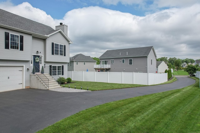 105 Hidden Pines Cir, Meriden, CT 06451 - view of home's exterior with a chimney, a residential view, an attached garage, and driveway