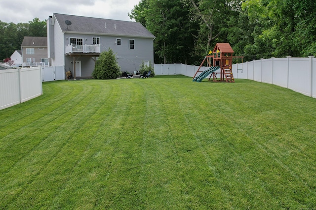 105 Hidden Pines Cir, Meriden, CT 06451 - fenced backyard featuring a playground