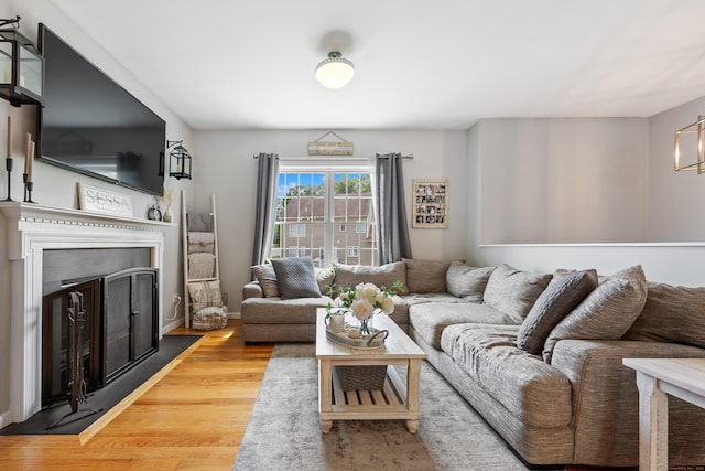 105 Hidden Pines Cir, Meriden, CT 06451 - living area featuring a fireplace, wood finished floors, and a chandelier