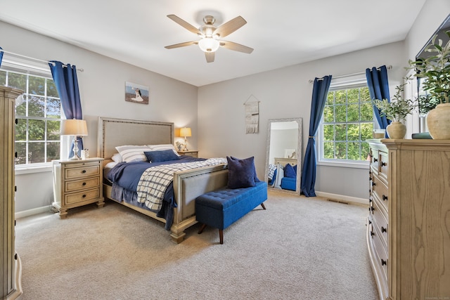 105 Hidden Pines Cir, Meriden, CT 06451 - bedroom with multiple windows, light colored carpet, and ceiling fan