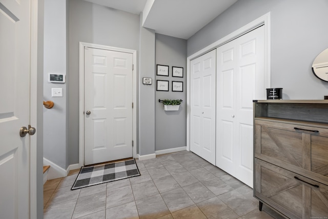 105 Hidden Pines Cir, Meriden, CT 06451 - foyer entrance with baseboards and light tile patterned floors