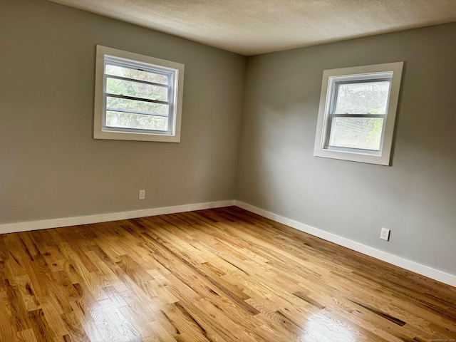 179 Mcgrath Ct, Stratford, CT 06615 - spare room with light wood finished floors and a textured ceiling
