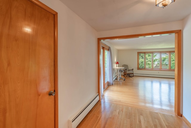 62 Clematis Rd, Agawam, MA 01001 - hall featuring a baseboard radiator, a baseboard heating unit, and light wood-style floors
