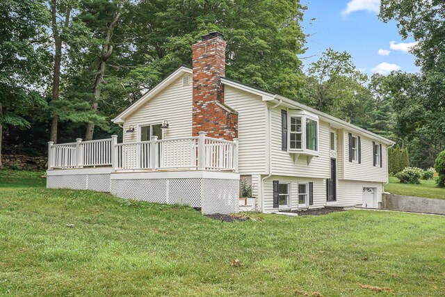 471 Moosup Pond Rd, Plainfield, CT 06354 - view of property exterior with a lawn, a deck, a chimney, and view of scattered trees