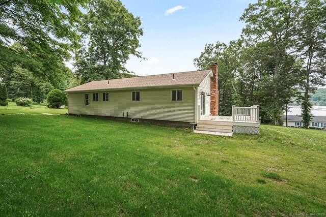 471 Moosup Pond Rd, Plainfield, CT 06354 - rear view of property with a chimney, a wooden deck, and a yard