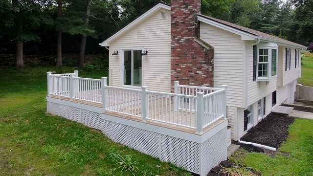 471 Moosup Pond Rd, Plainfield, CT 06354 - back of property featuring a chimney, a deck, and a yard