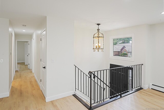 471 Moosup Pond Rd, Plainfield, CT 06354 - hall with an upstairs landing, light wood-type flooring, a chandelier, baseboard heating, and recessed lighting