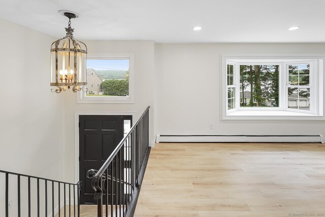 471 Moosup Pond Rd, Plainfield, CT 06354 - entryway featuring a chandelier, wood finished floors, recessed lighting, and a baseboard radiator