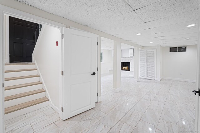 471 Moosup Pond Rd, Plainfield, CT 06354 - finished below grade area featuring a fireplace, a drop ceiling, stairway, and recessed lighting