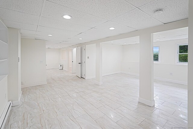 471 Moosup Pond Rd, Plainfield, CT 06354 - below grade area with baseboard heating, a paneled ceiling, and recessed lighting