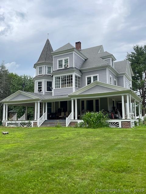 2 Judd Ave, Bethel, CT 06801 - back of property featuring covered porch, a yard, a chimney, and a shingled roof